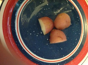 red potatoes cooked but unpeeled